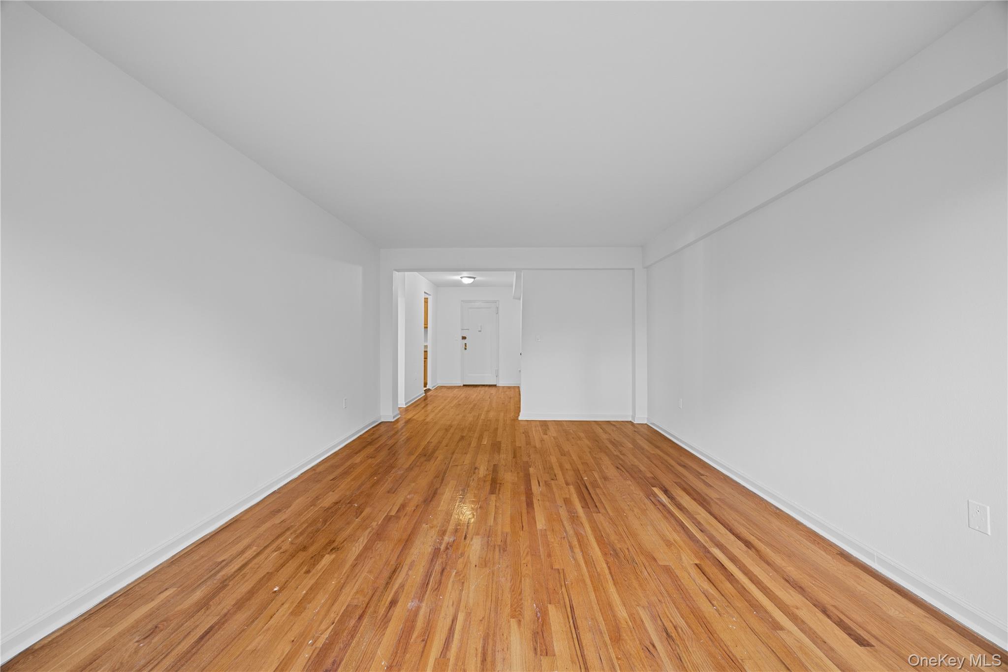 255 Bronx River Road, Unit 4M Yonkers, NY 10704 - Photo 11 of 19 a view of wooden floor in a room