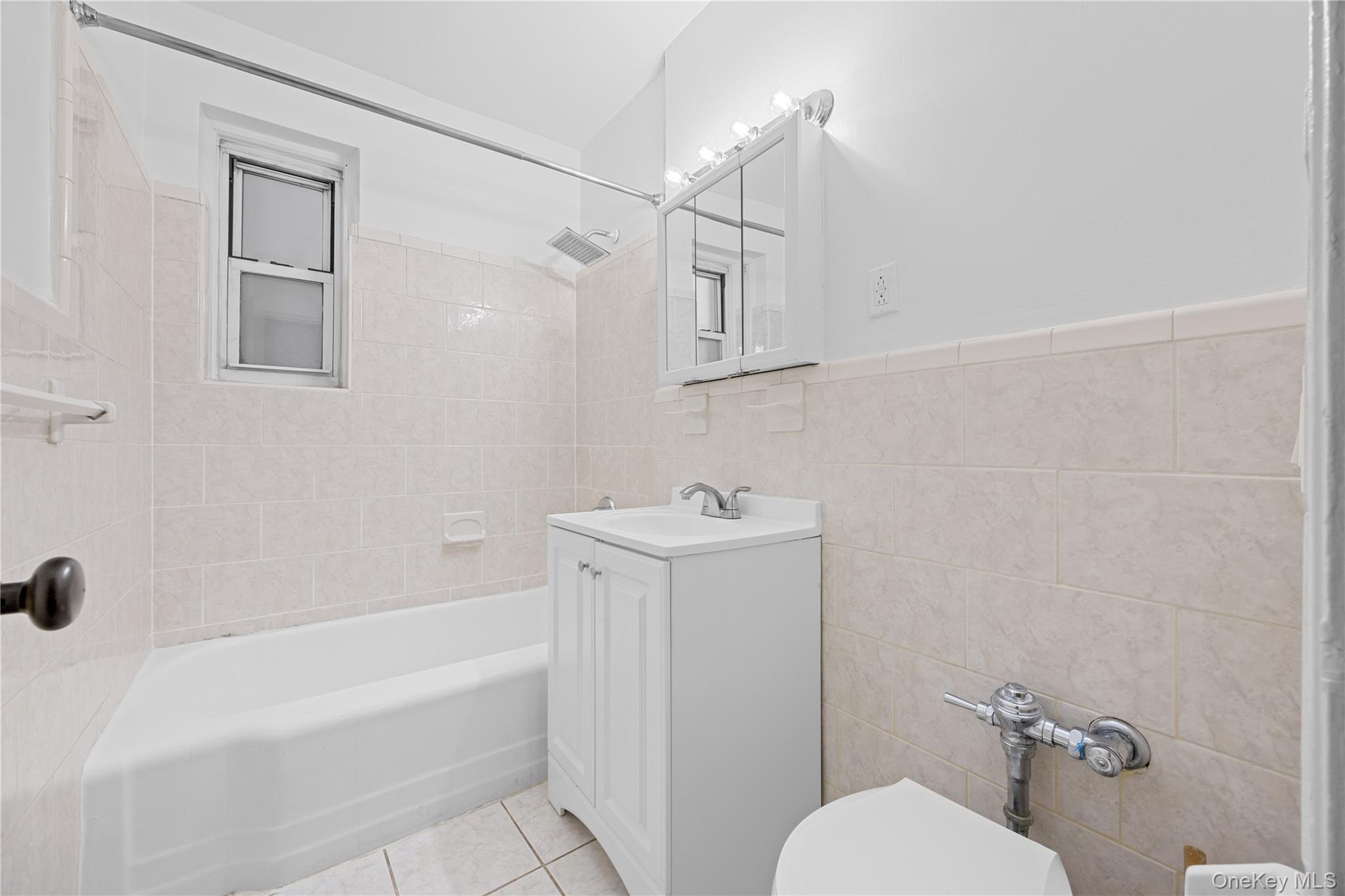 255 Bronx River Road, Unit 4M Yonkers, NY 10704 - Photo 12 of 19 a bathroom with a sink a toilet and shower