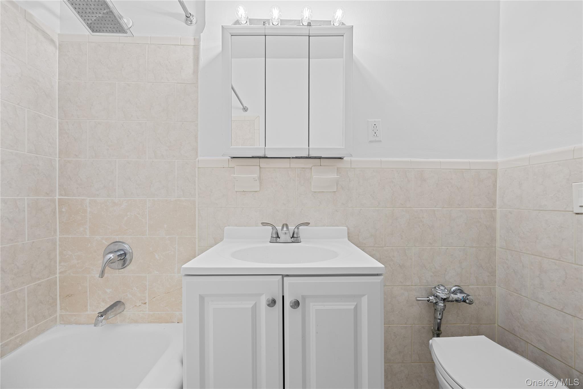 255 Bronx River Road, Unit 4M Yonkers, NY 10704 - Photo 13 of 19 a bathroom with a sink a toilet and shower