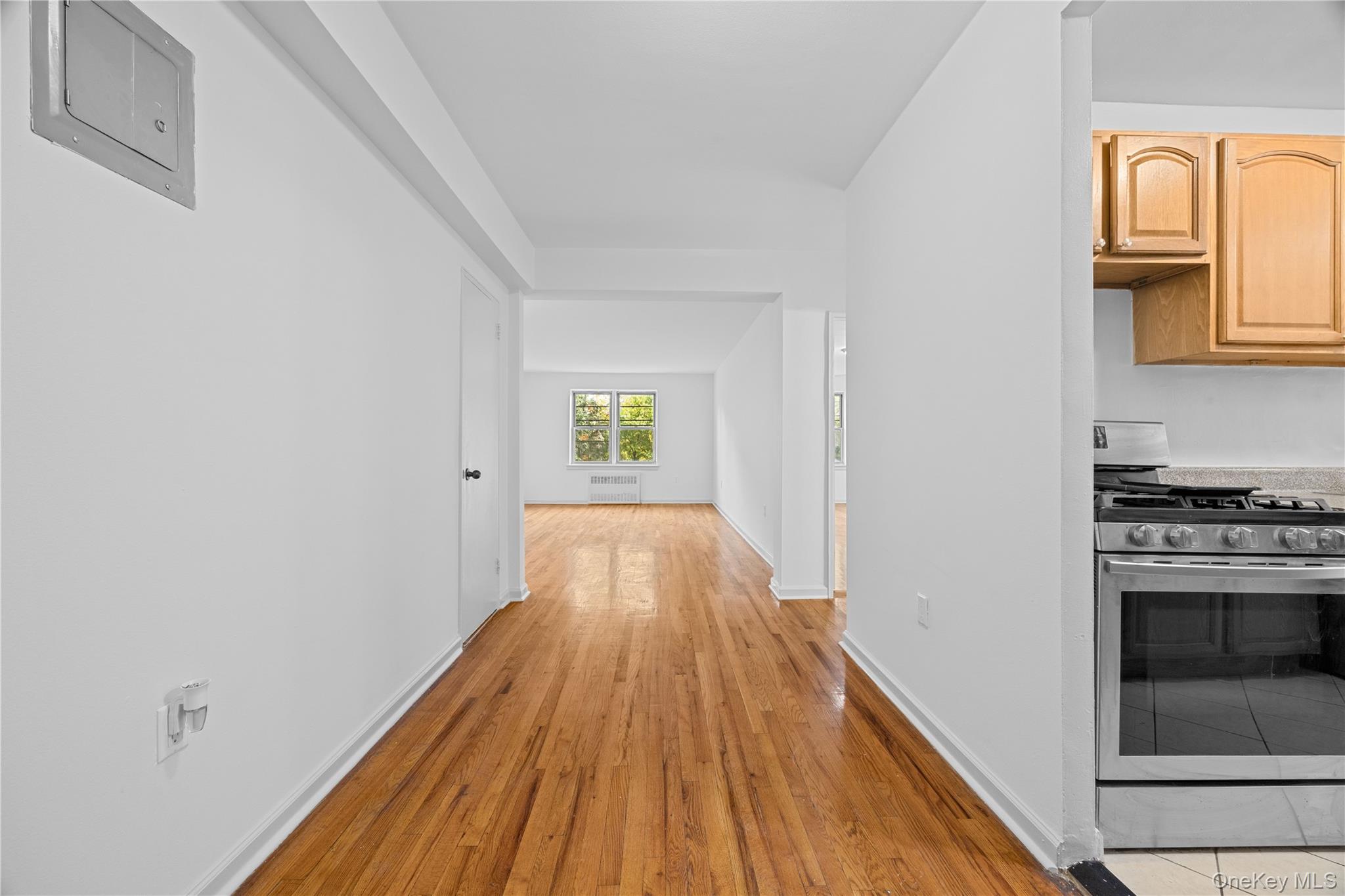 255 Bronx River Road, Unit 4M Yonkers, NY 10704 - Photo 4 of 19 a view of a kitchen from the hallway