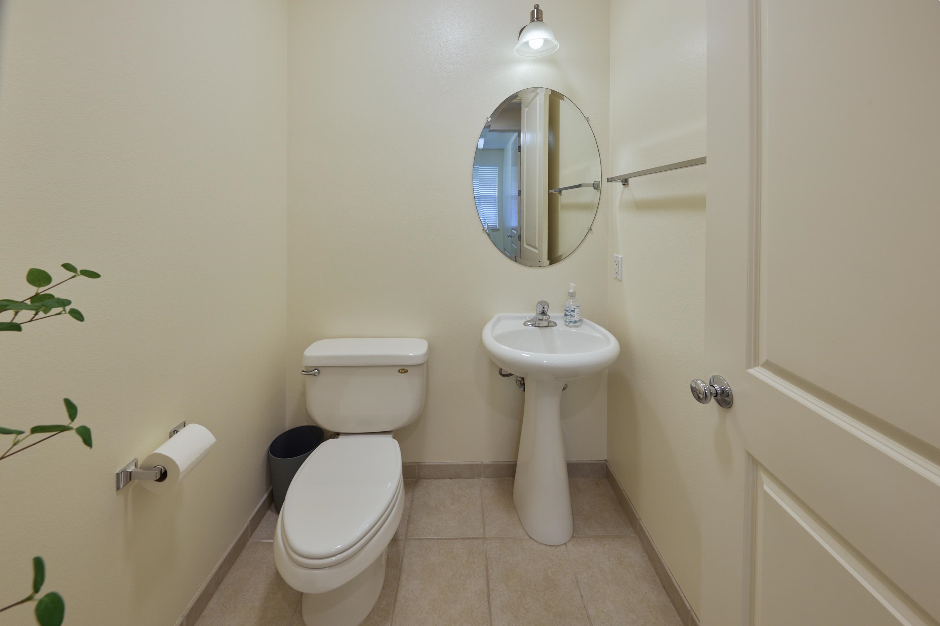 133 Kinohi Loa Loop Wailuku, HI 96793 - Photo 12 of 45 a bathroom with a toilet sink and mirror