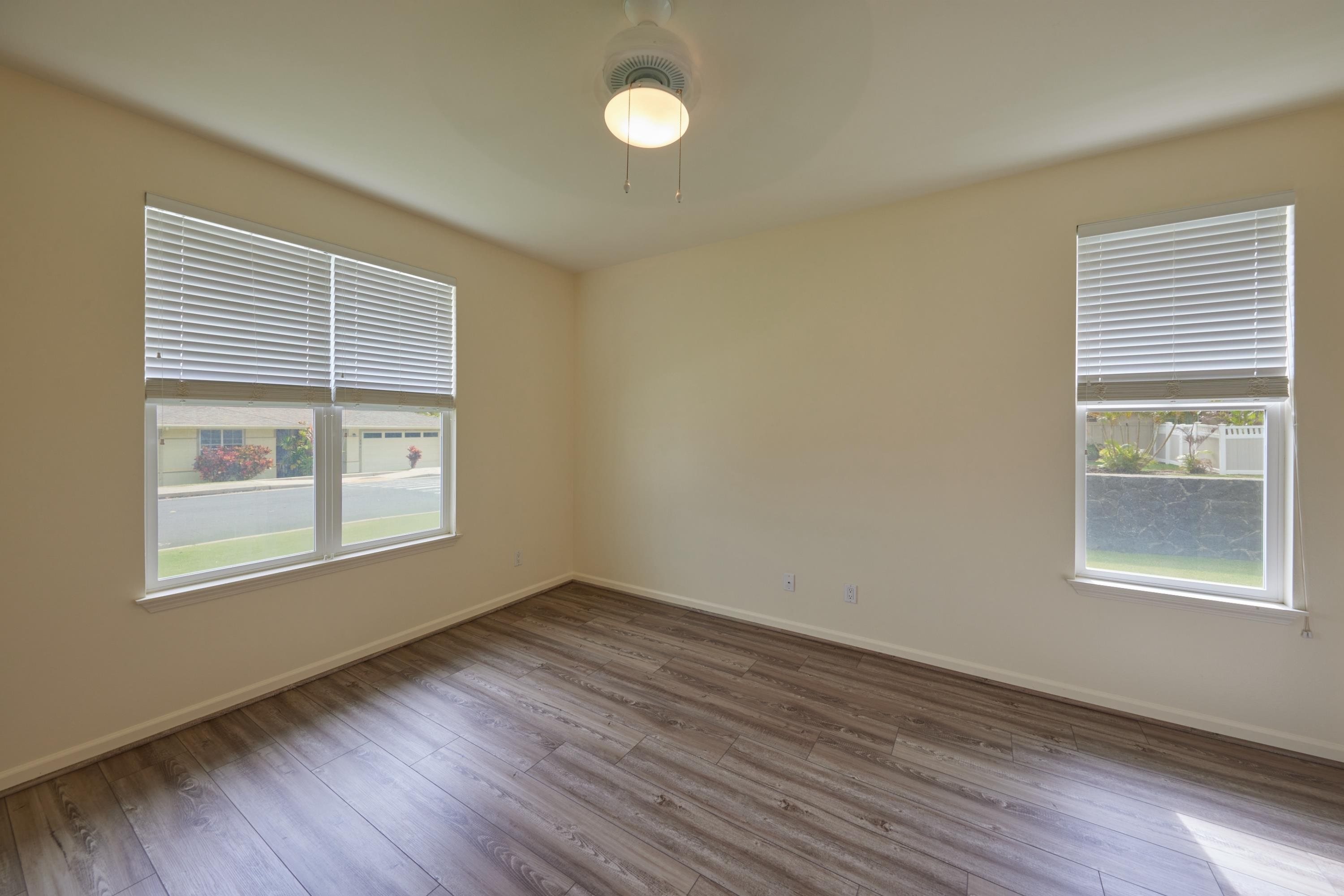 133 Kinohi Loa Loop Wailuku, HI 96793 - Photo 26 of 45 a view of an empty room with wooden floor and a window