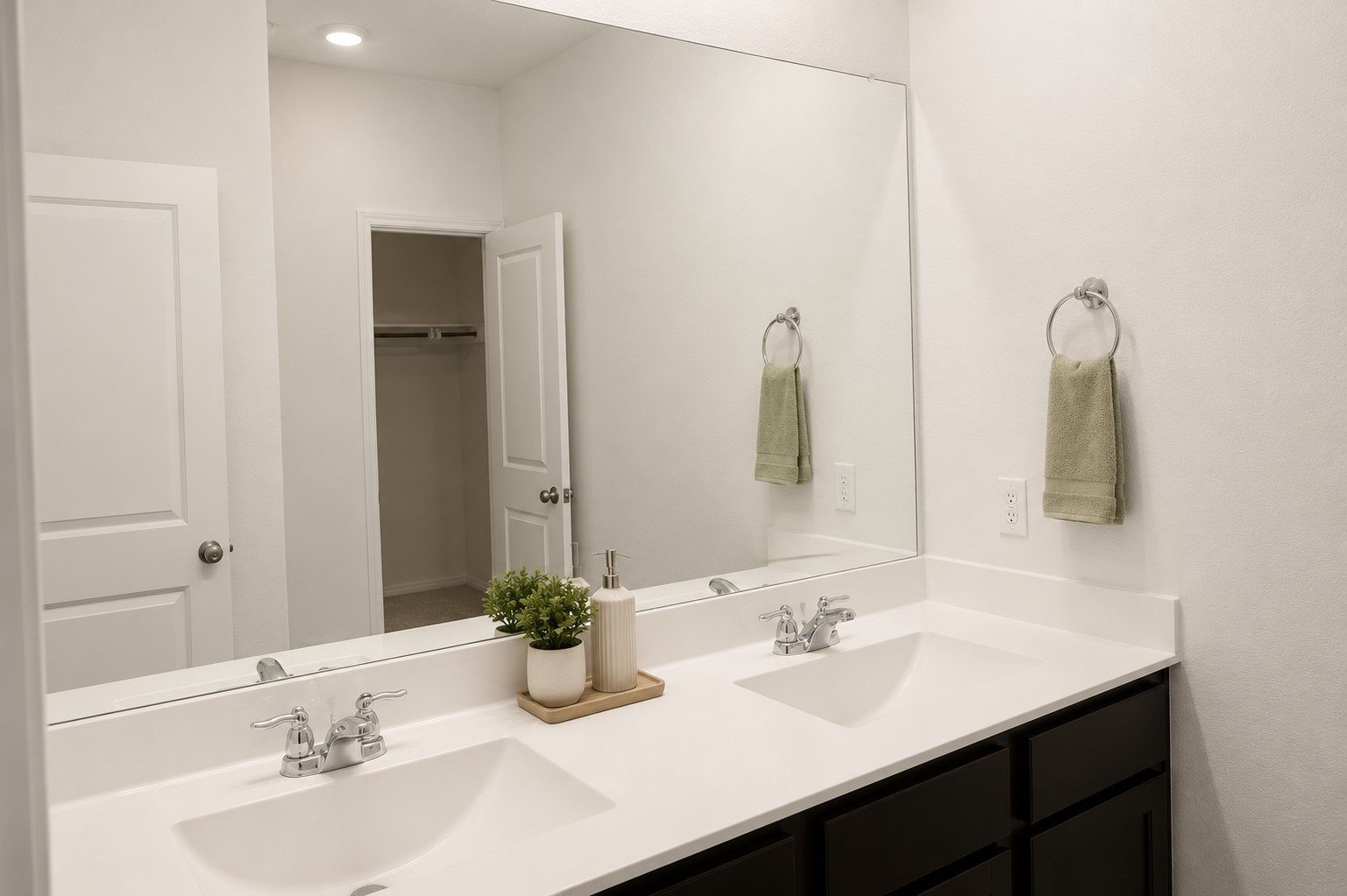 828 Mallow Road Leander, TX 78641 - Photo 11 of 14 Twin vanities offer ample space in this well-appointed, naturally illuminated bathroom.