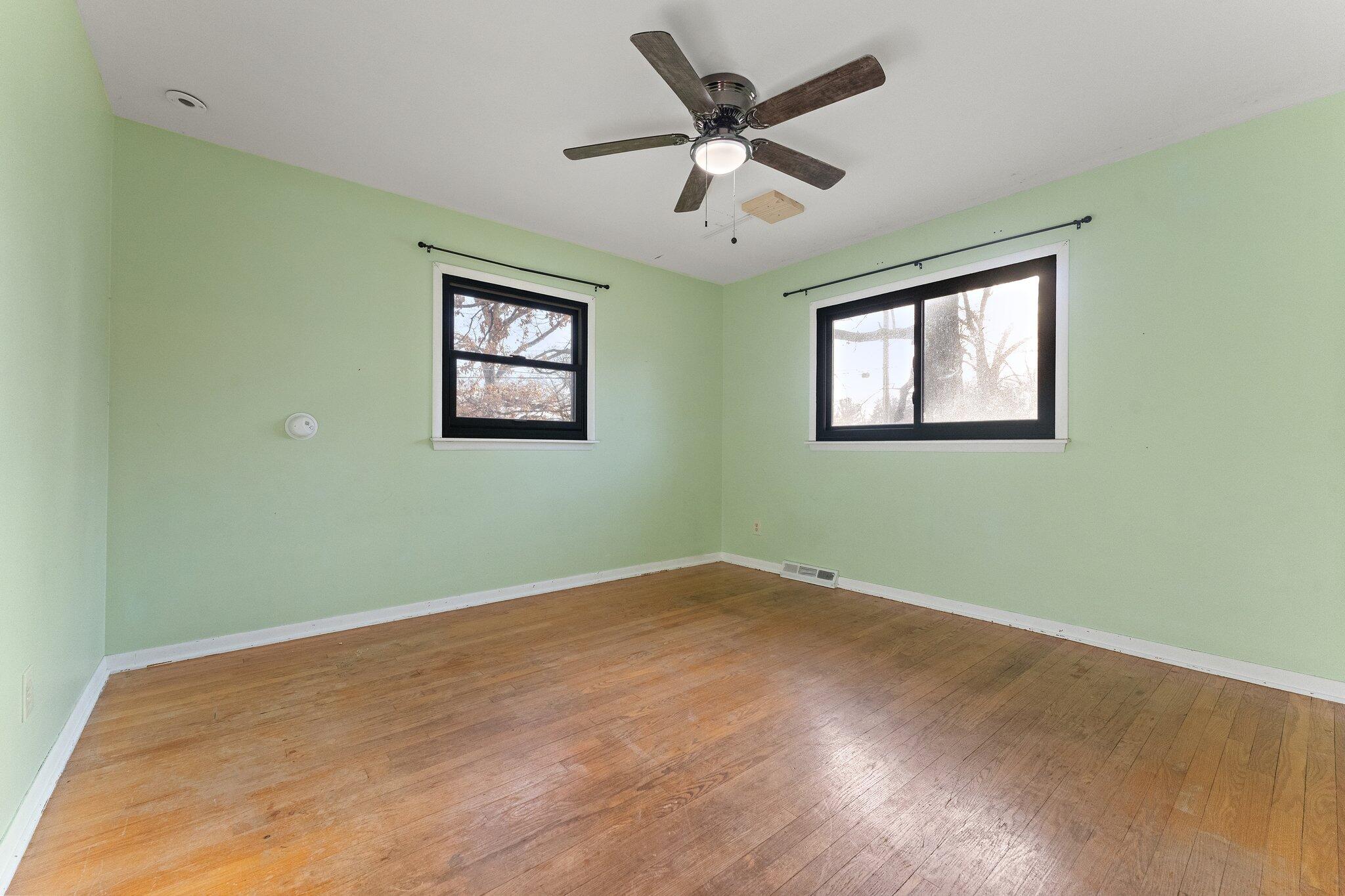 12163 North 900 West Demotte, IN 46310 - Photo 11 of 23 a view of an empty room with a window and a ceiling fan