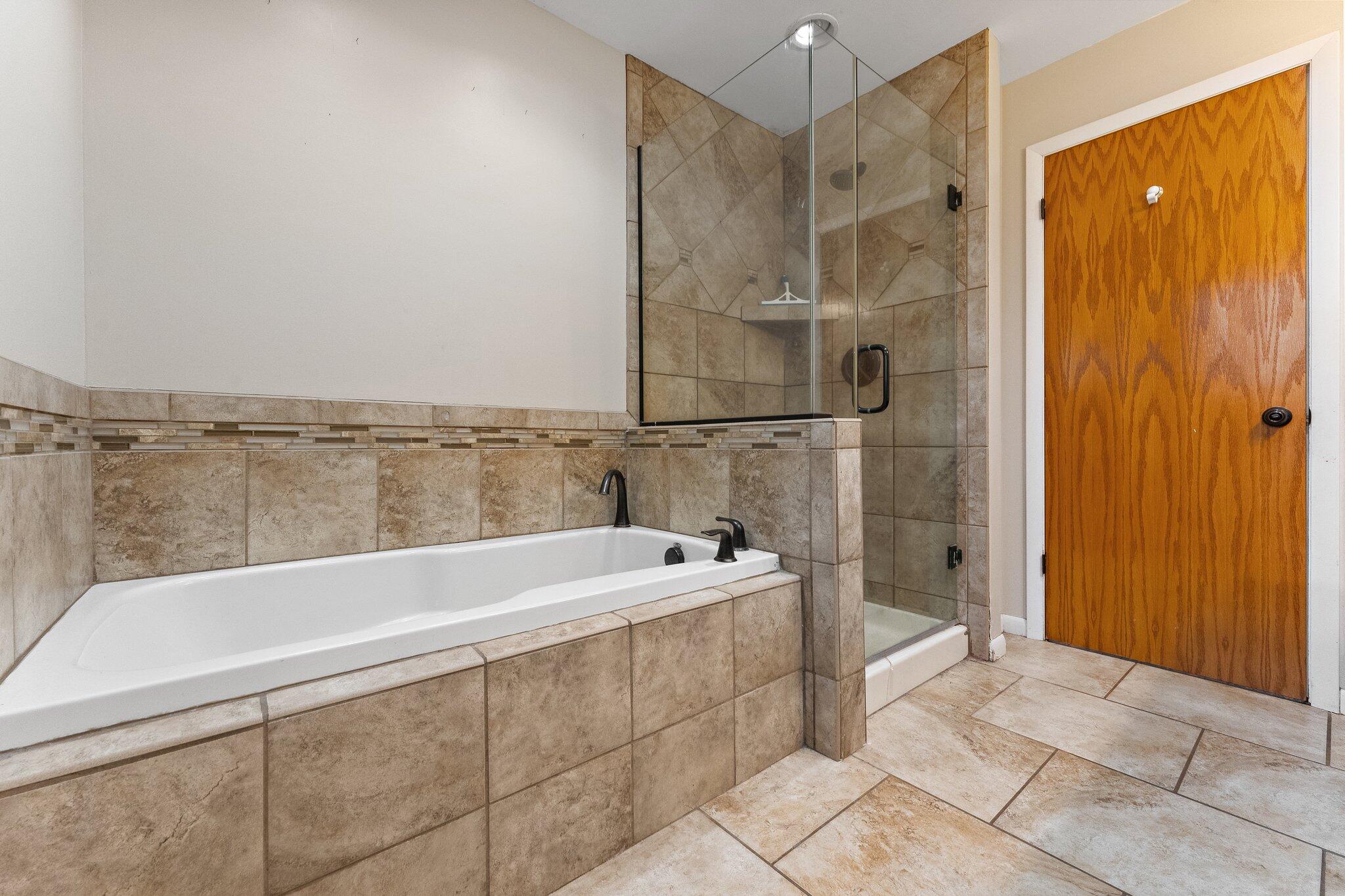 12163 North 900 West Demotte, IN 46310 - Photo 13 of 23 a bathroom with a bathtub and shower