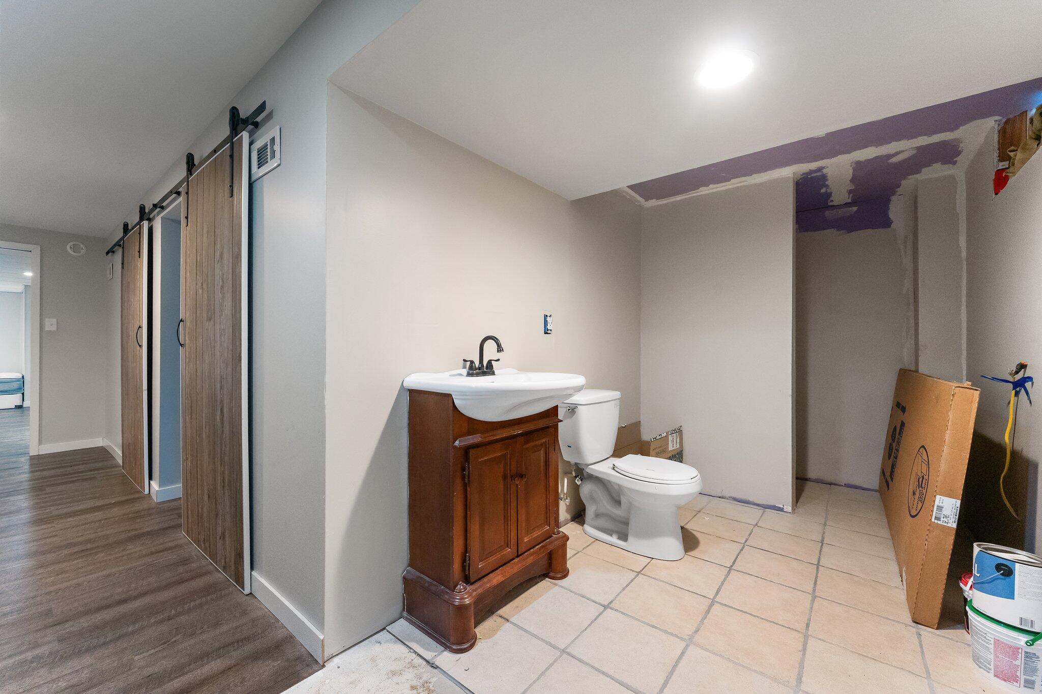 12163 North 900 West Demotte, IN 46310 - Photo 20 of 23 a bathroom with a sink toilet and shower