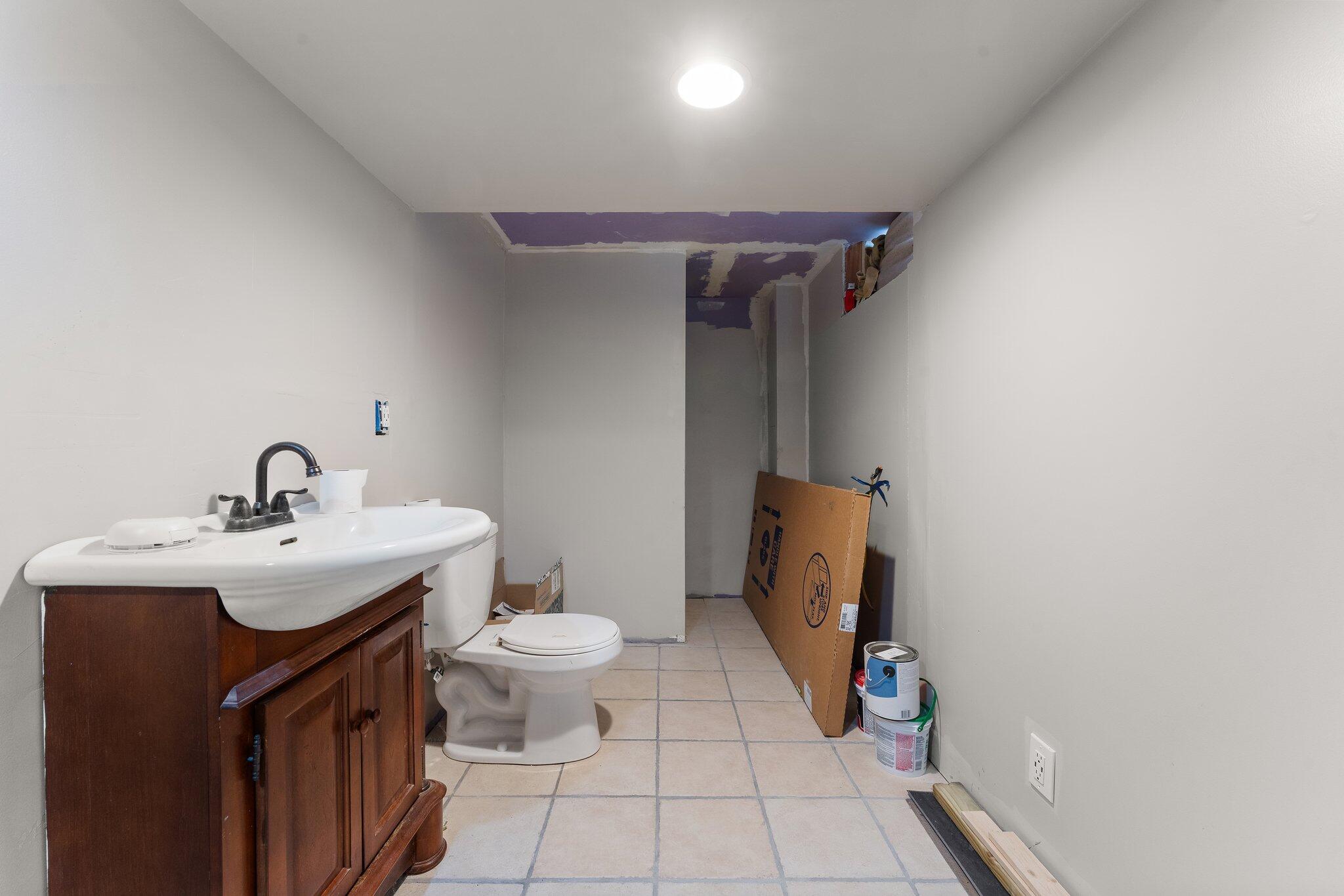 12163 North 900 West Demotte, IN 46310 - Photo 22 of 23 a bathroom with a sink toilet and mirror