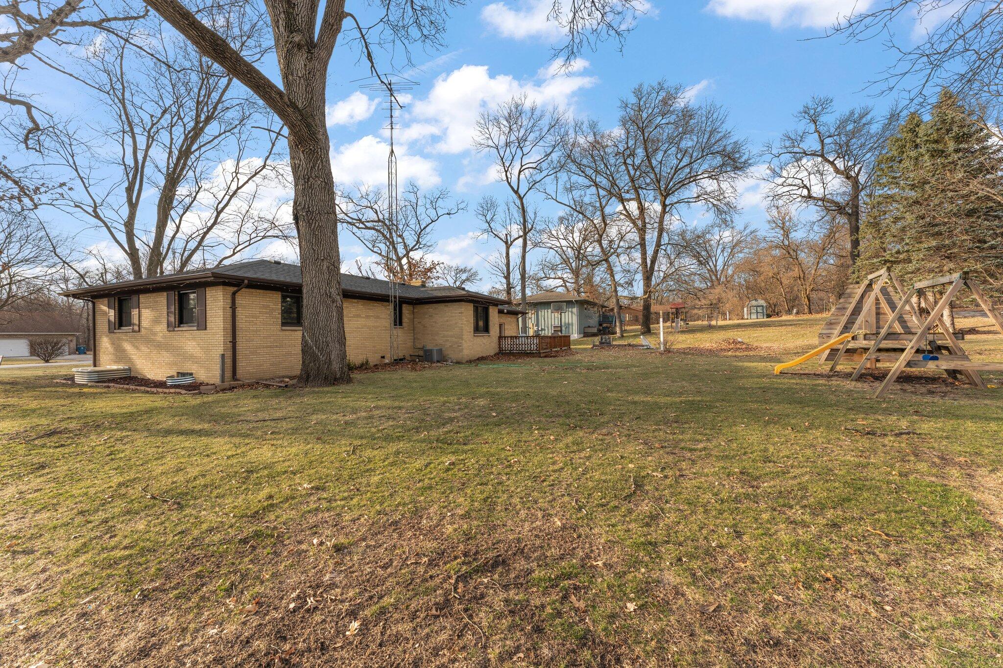 12163 North 900 West Demotte, IN 46310 - Photo 4 of 23 a view of a yard with a house