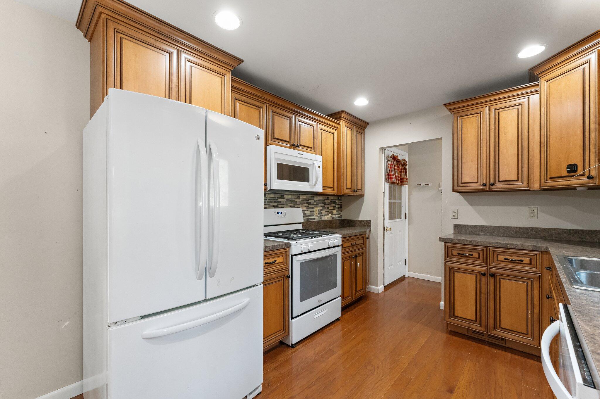 12163 North 900 West Demotte, IN 46310 - Photo 8 of 23 a kitchen with stainless steel appliances a refrigerator stove and microwave