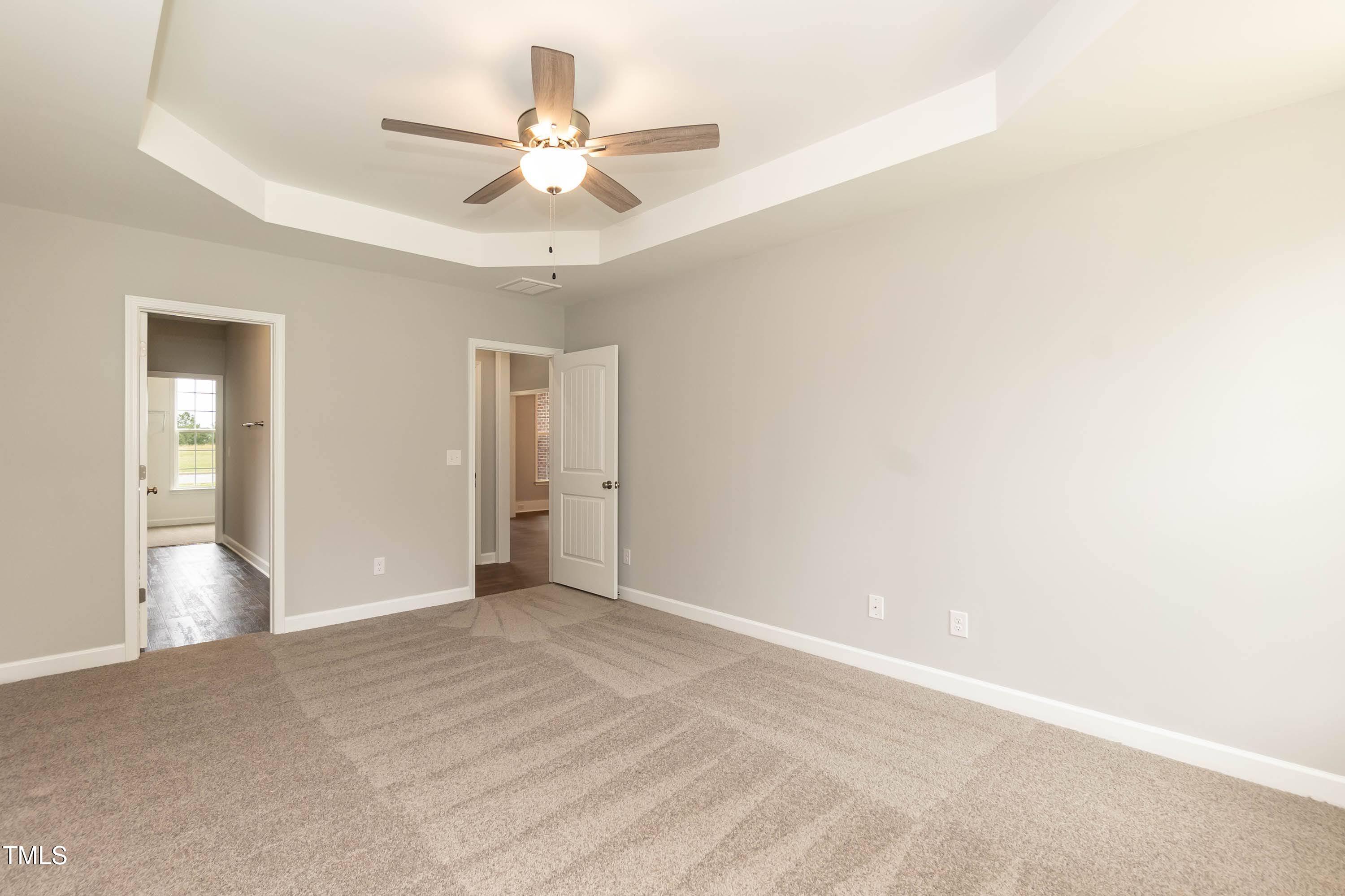 748 Rivers Edge Parkway Roanoke Rapids, NC 27870 - Photo 10 of 42 a view of an empty room with a ceiling fan