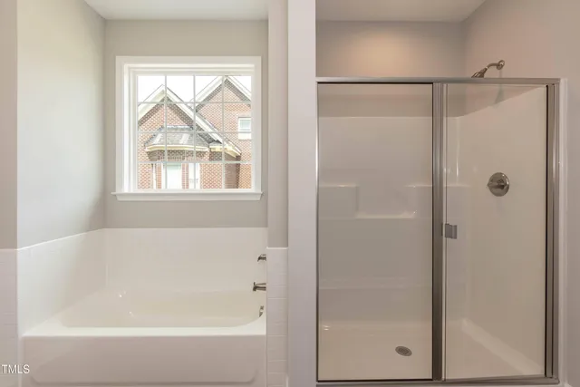 a open kitchen with kitchen island a sink window and refrigerator