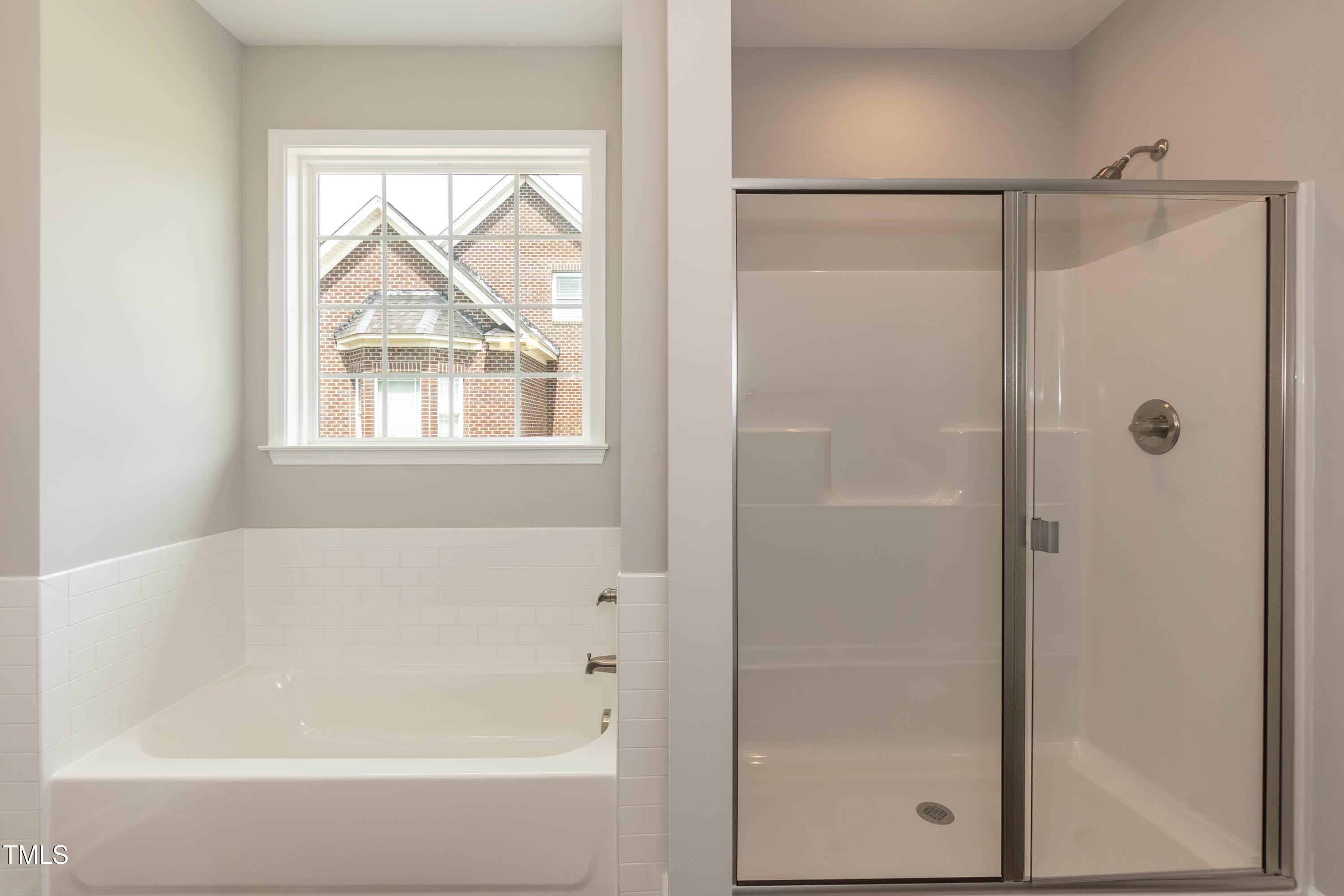 748 Rivers Edge Parkway Roanoke Rapids, NC 27870 - Photo 12 of 42 a bathroom with a bathtub and shower