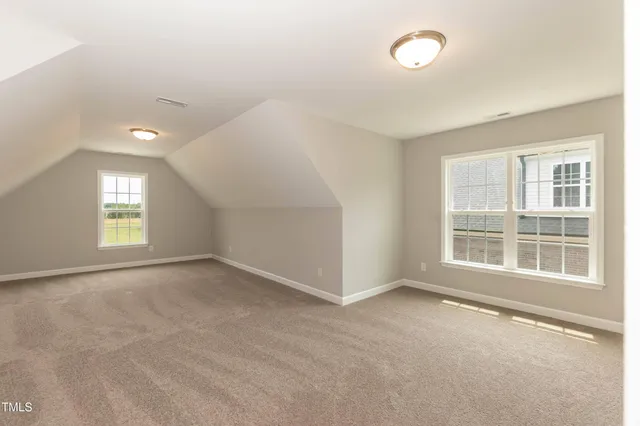 a spacious bathroom with a double vanity sink and mirror