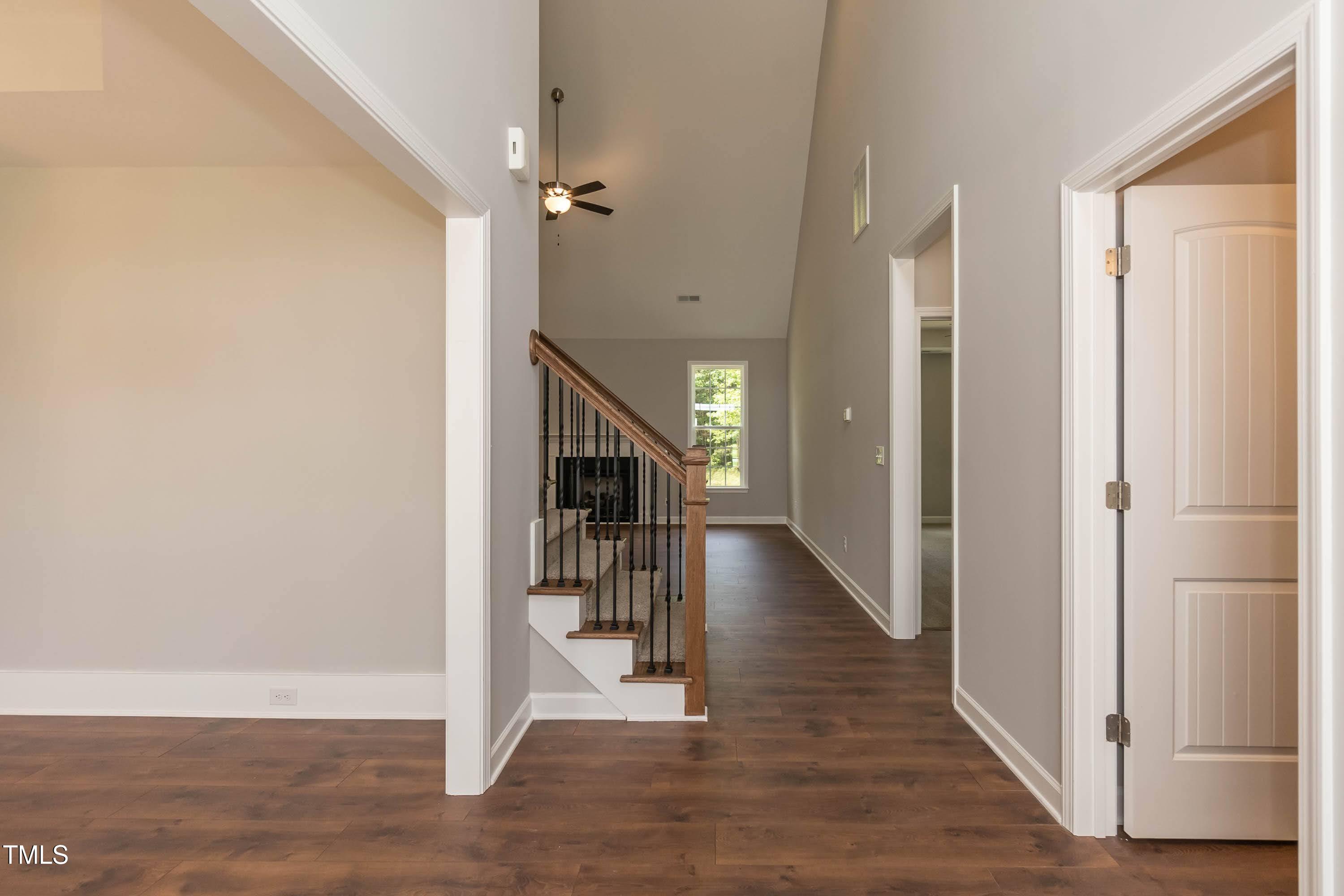 748 Rivers Edge Parkway Roanoke Rapids, NC 27870 - Photo 2 of 42 a view of a hallway with wooden floor and staircase