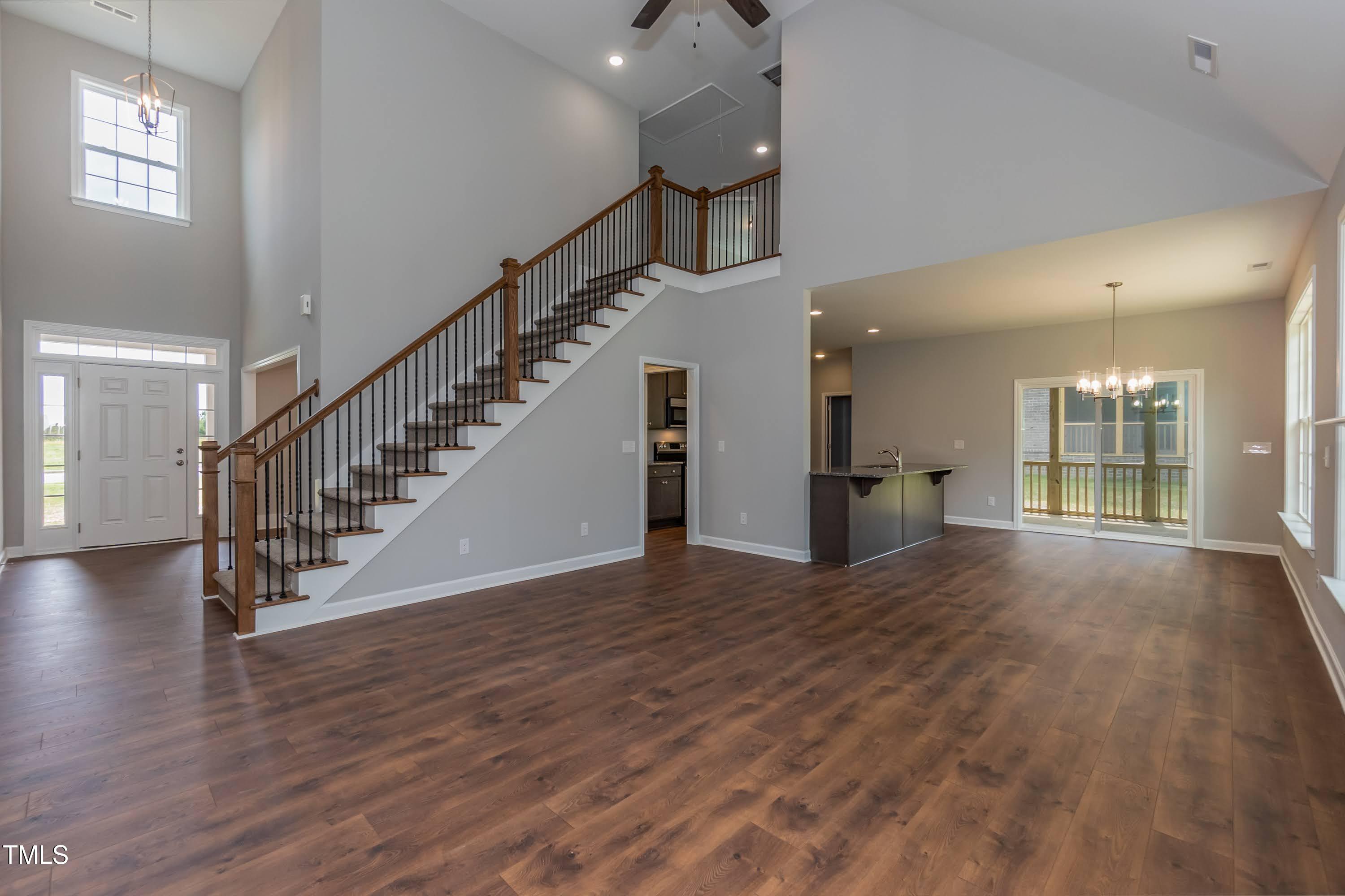 748 Rivers Edge Parkway Roanoke Rapids, NC 27870 - Photo 4 of 42 an empty room with wooden floor and windows