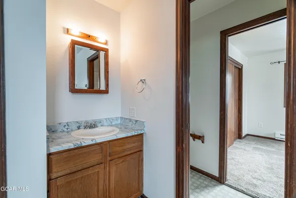a bathroom with a sink and mirror