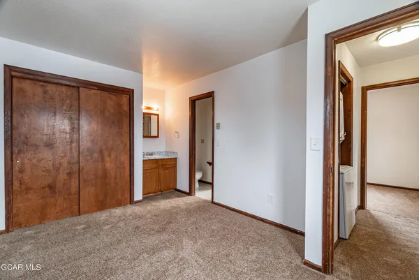 a view of a bathroom with a shower and a sink