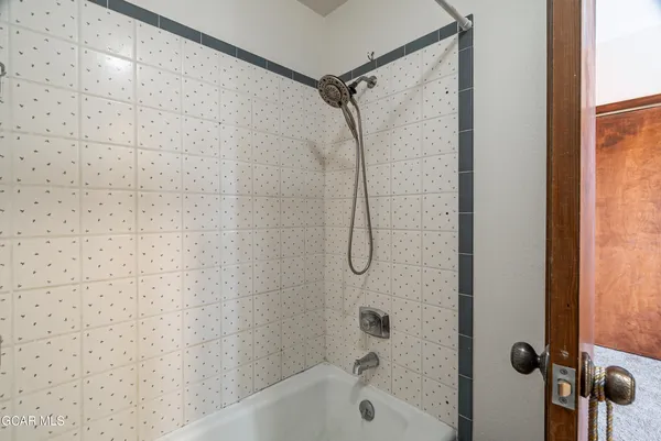 a bathroom with a bath tub