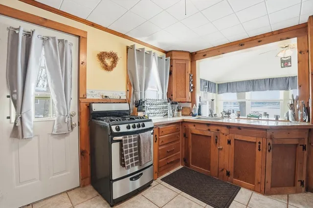 a kitchen with stainless steel appliances granite countertop a stove and a sink