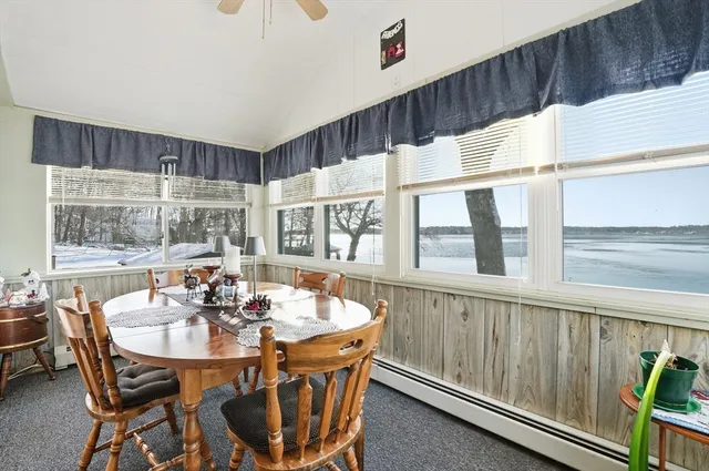 a dining room with furniture and window