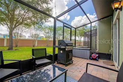 a view of a porch with chairs and backyard