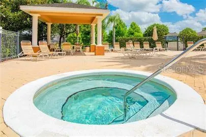a view of a swimming pool with a patio