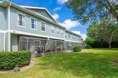 a view of a house with a yard and plants