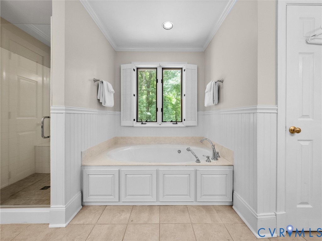 2011 Gamelaw Court Midlothian, VA 23113 - Photo 37 of 77 a bathroom with a sink a bath tub and a window