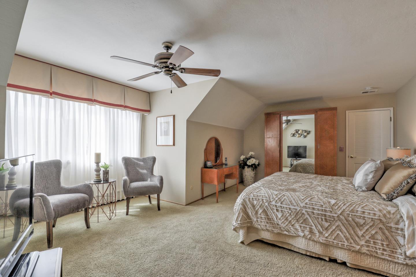 19923 Lanark Lane Saratoga, CA 95070 - Photo 21 of 34 a bedroom with a bed and furniture