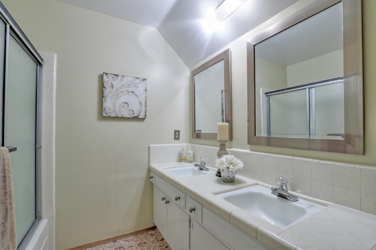 19923 Lanark Lane Saratoga, CA 95070 - Photo 27 of 34 a bathroom with a sink and a mirror