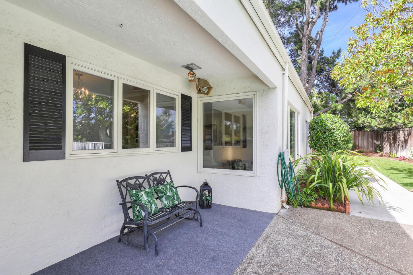 19923 Lanark Lane Saratoga, CA 95070 - Photo 29 of 34 a view of a patio with table and chairs and potted plants