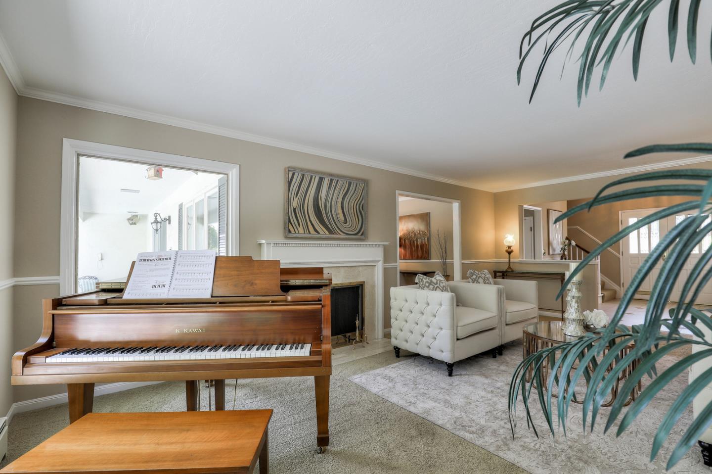 19923 Lanark Lane Saratoga, CA 95070 - Photo 9 of 34 a living room with furniture and a fireplace