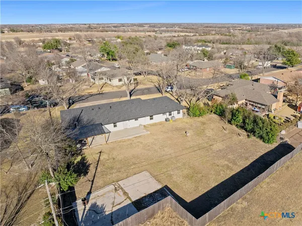 a view of house with a yard