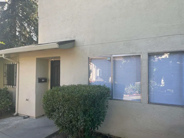 a view of a house with a small yard