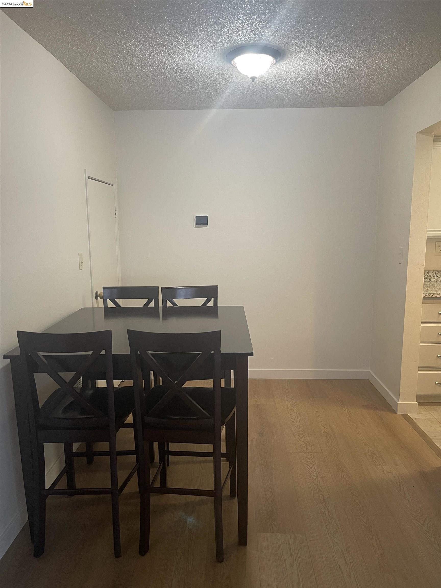 1096 Mohr Lane Concord, CA 94518 - Photo 12 of 34 a view of a dining room with furniture and chandelier
