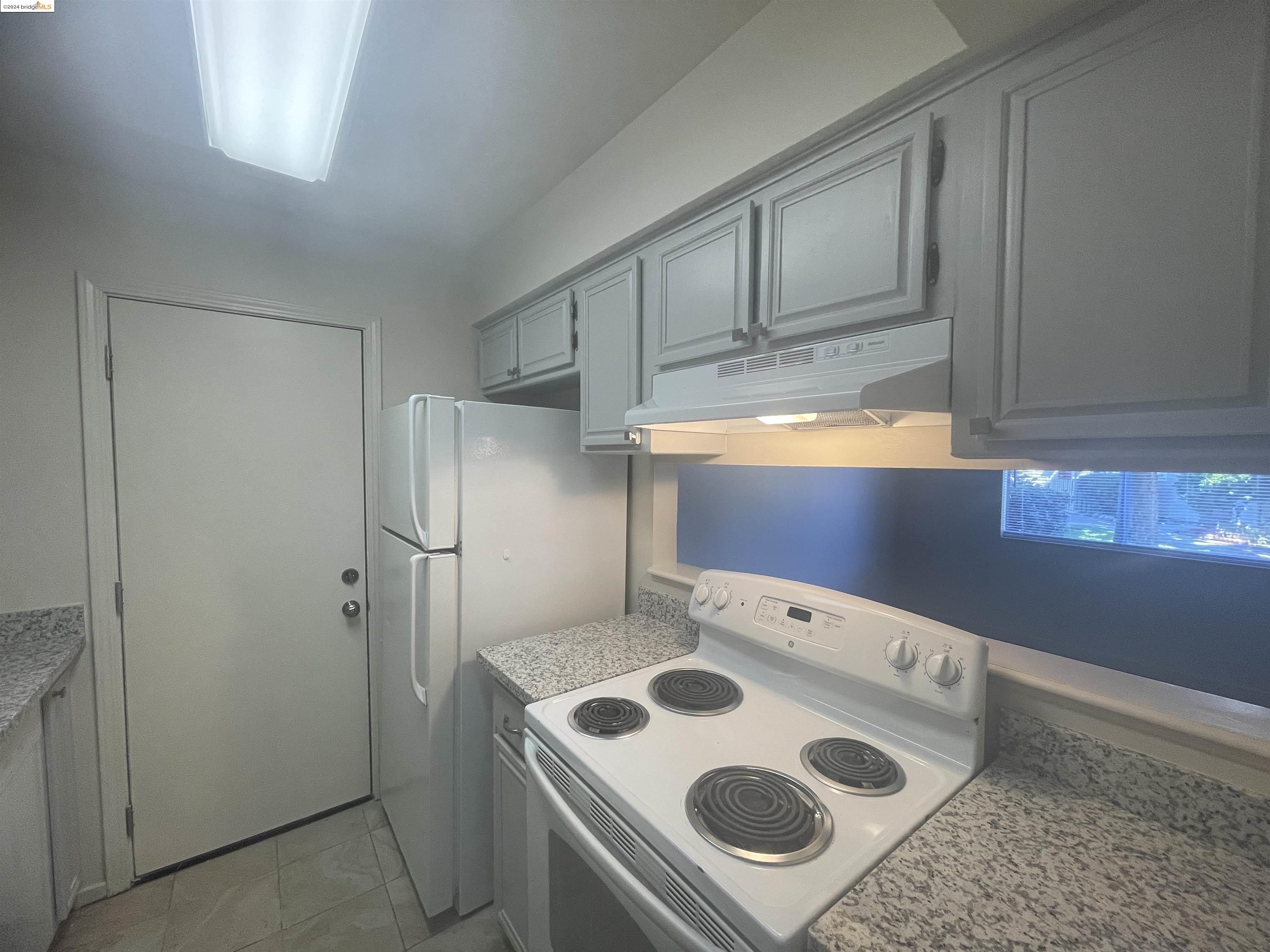 1096 Mohr Lane Concord, CA 94518 - Photo 16 of 34 a kitchen with a refrigerator and a stove