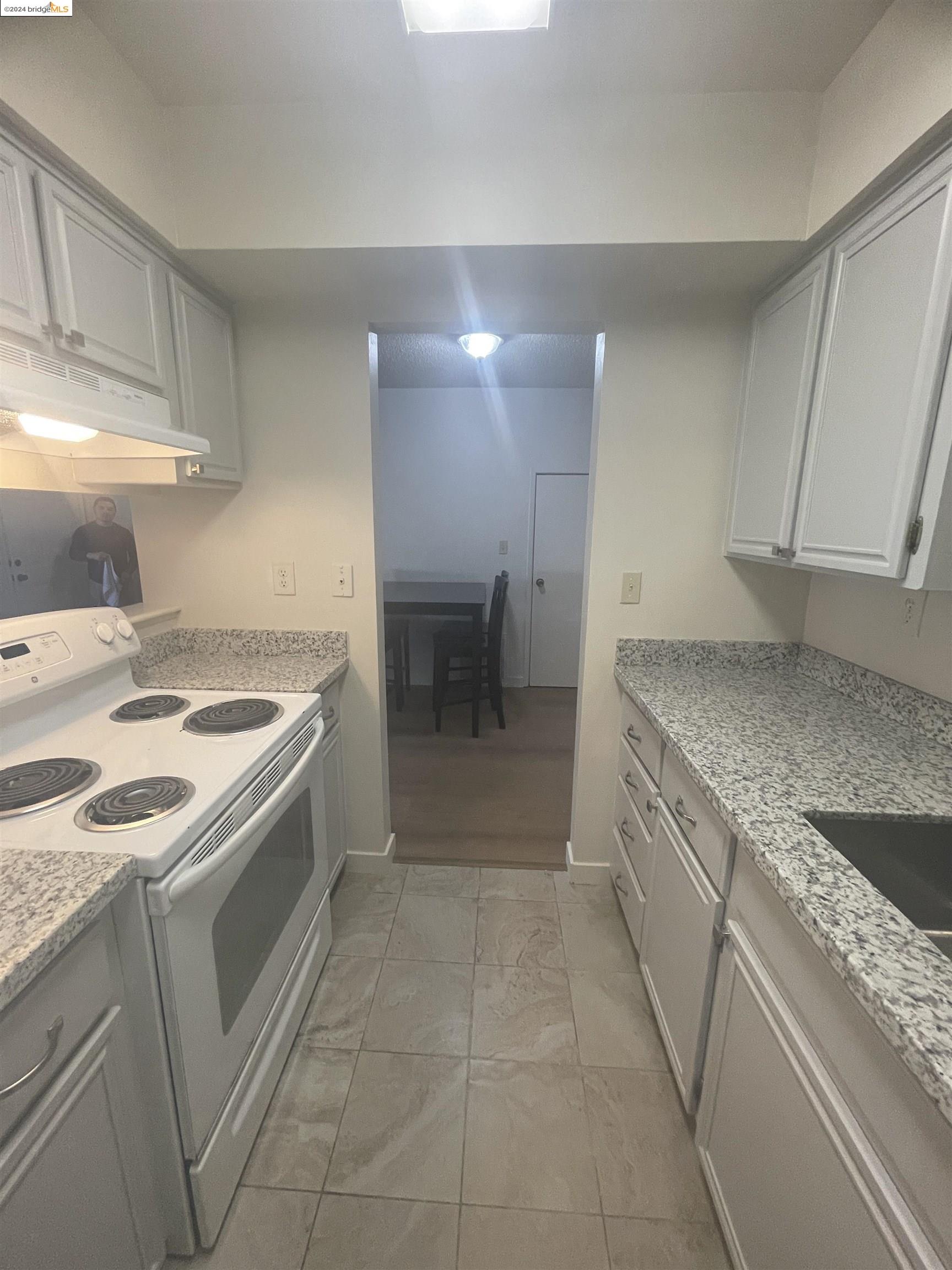 1096 Mohr Lane Concord, CA 94518 - Photo 18 of 34 a kitchen with a sink stove and cabinets