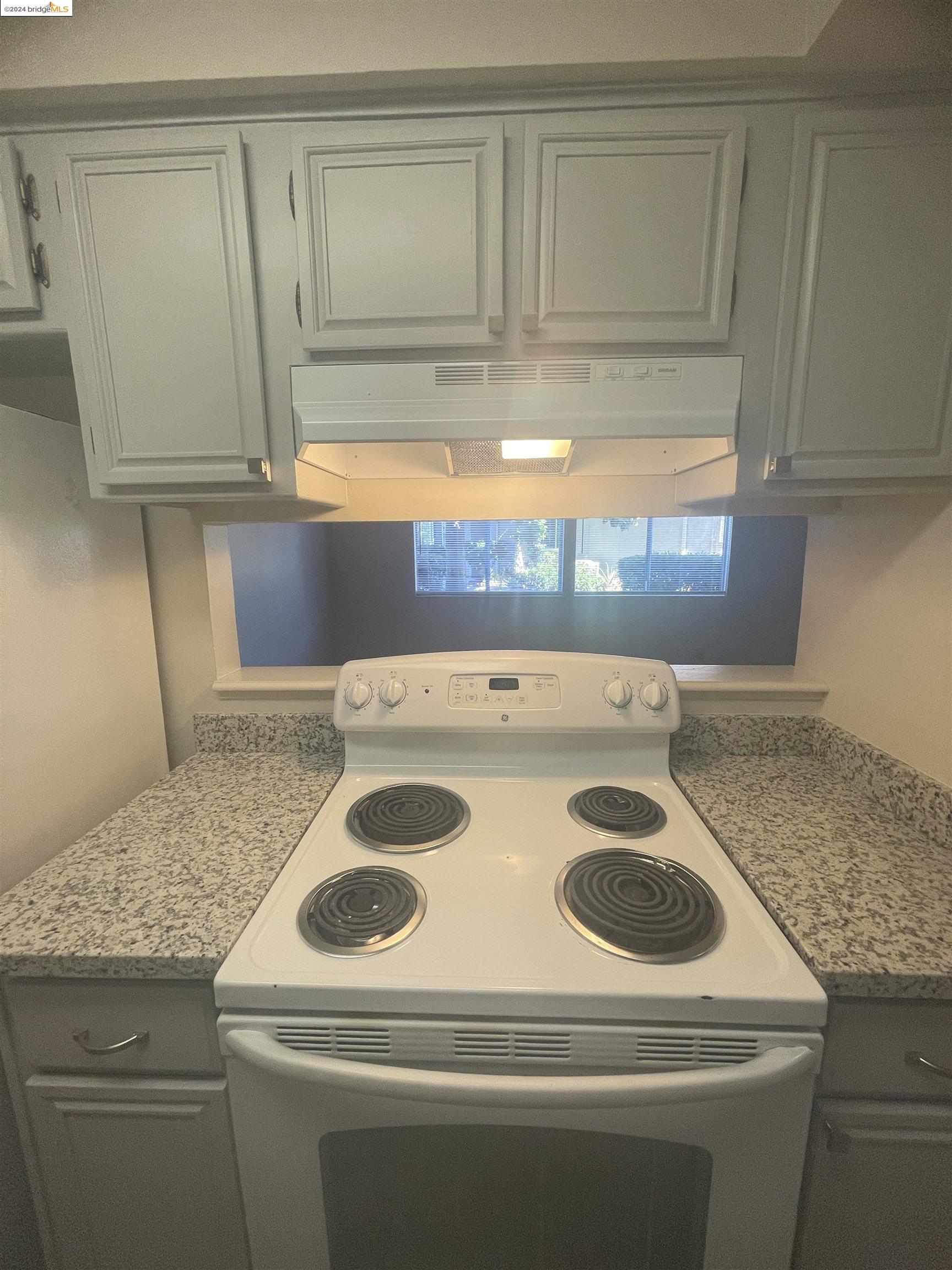 1096 Mohr Lane Concord, CA 94518 - Photo 19 of 34 a kitchen with a sink and a stove top oven