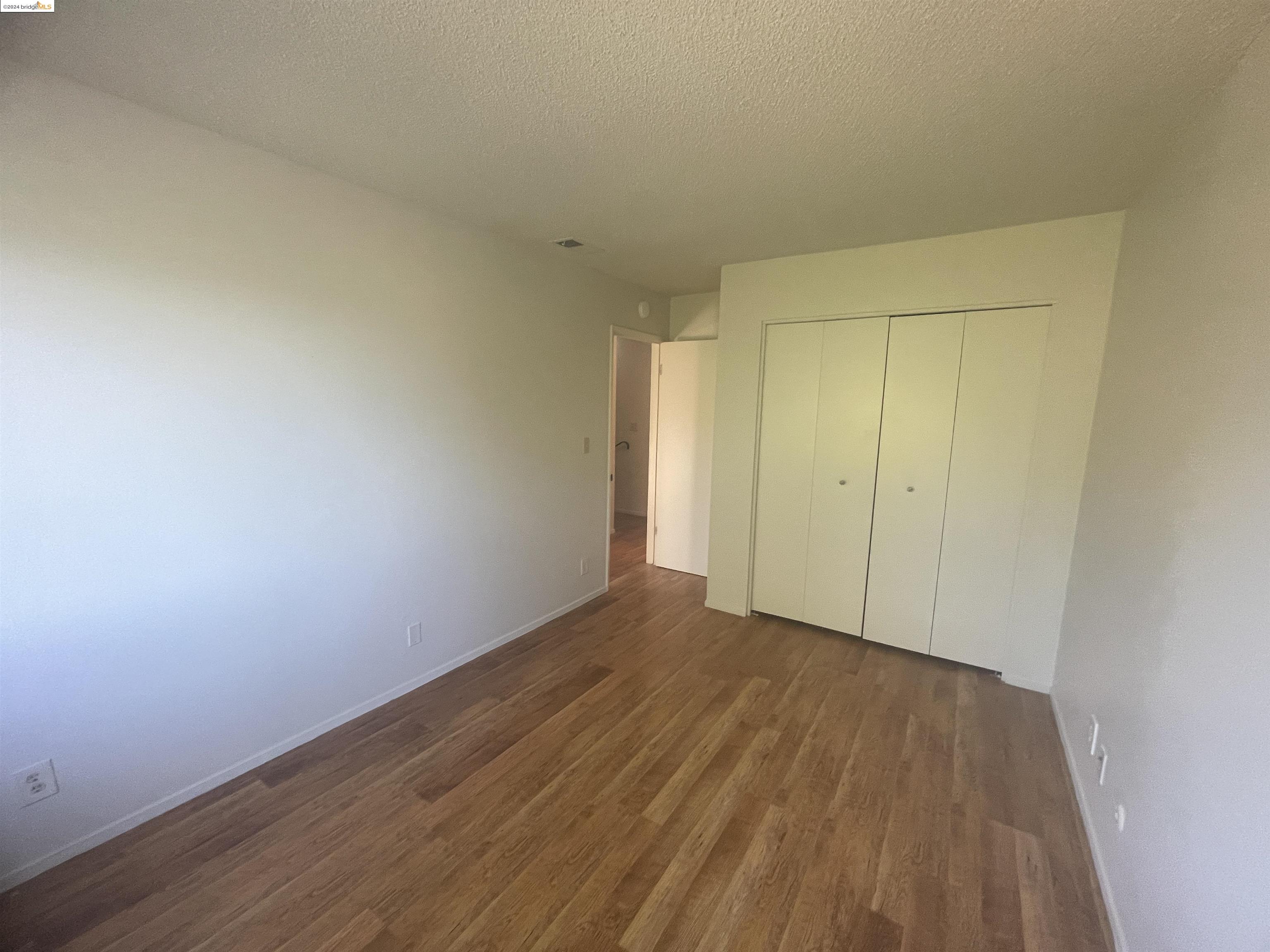 1096 Mohr Lane Concord, CA 94518 - Photo 30 of 34 a view of an empty room with wooden floor