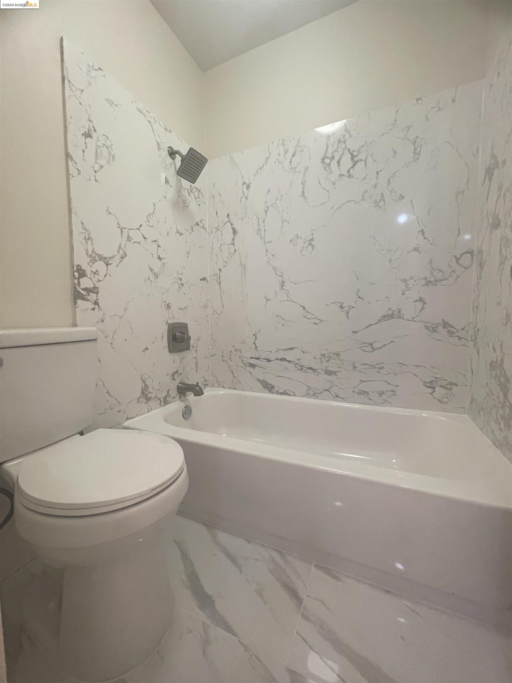 1096 Mohr Lane Concord, CA 94518 - Photo 33 of 34 a bathroom with a toilet and a bathtub