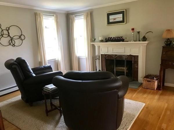 20 Meadow Lane Rochester, MA 02770 - Photo 9 of 26 a living room with furniture and a fireplace