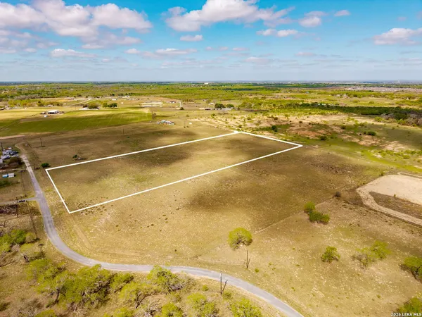 a view of a swimming pool and an outdoor space