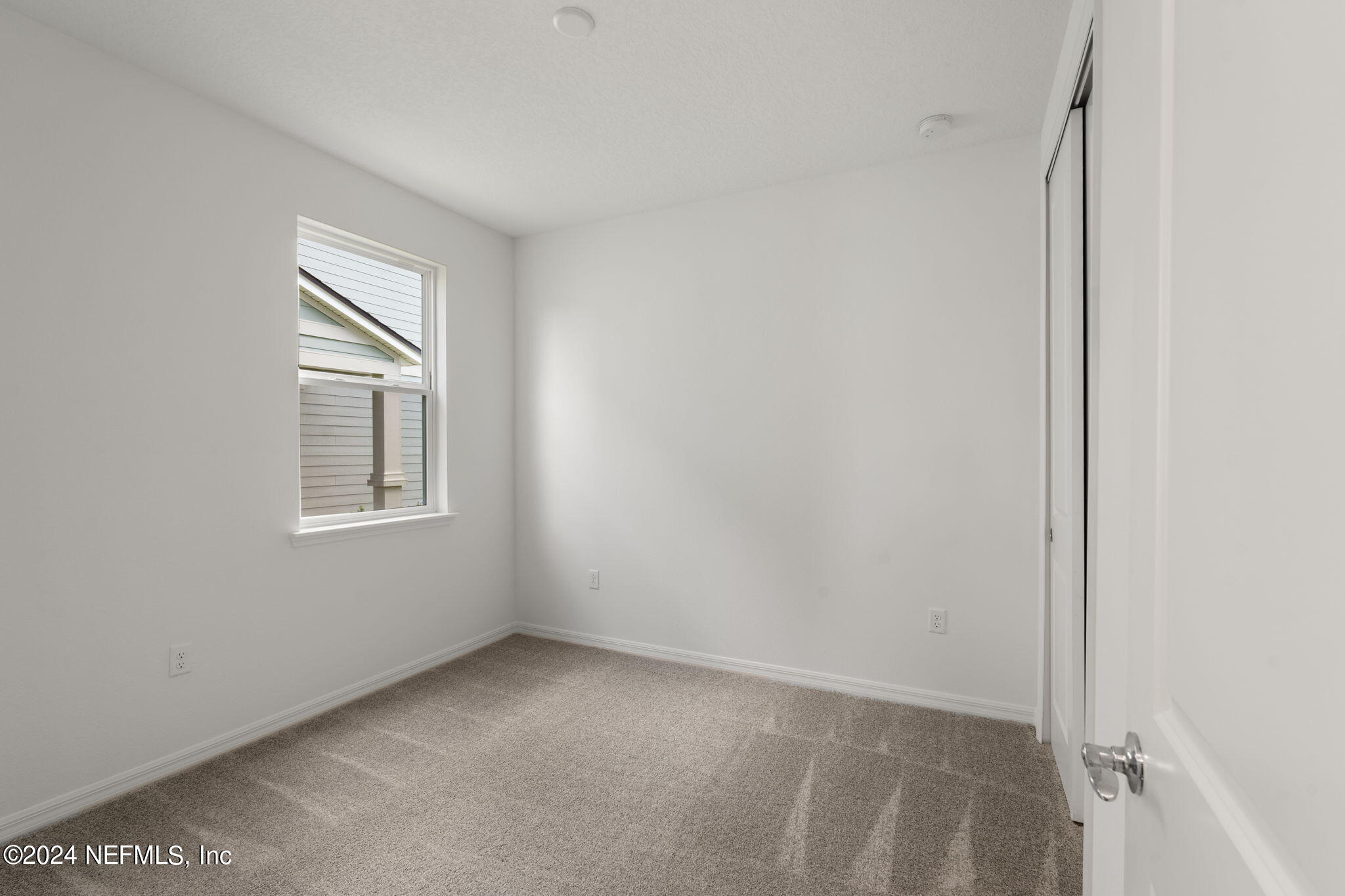 54 Torres Trace St. Augustine, FL 32095 - Photo 22 of 31 a view of an empty room with a window