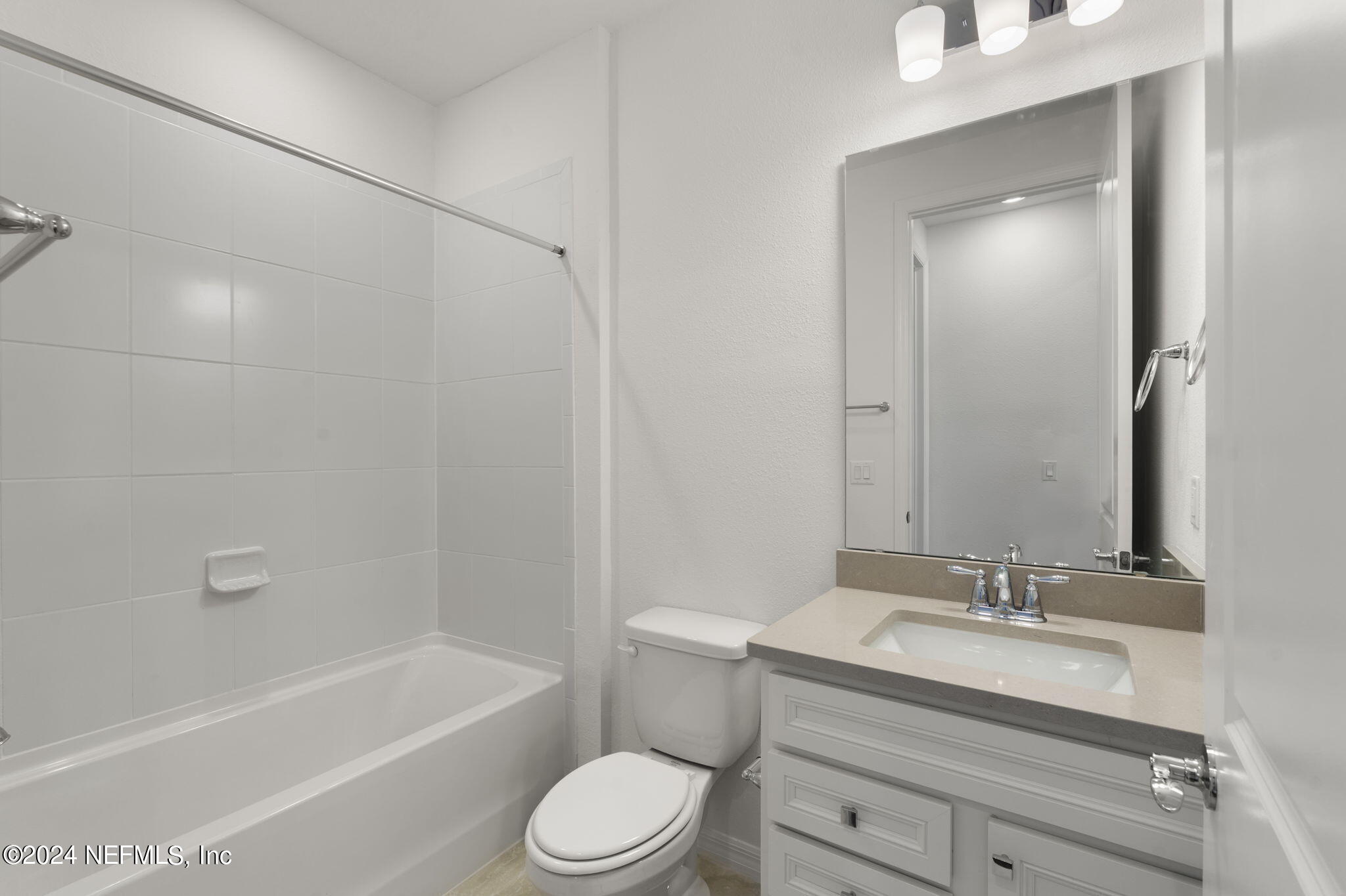 54 Torres Trace St. Augustine, FL 32095 - Photo 23 of 31 a bathroom with a granite countertop sink a toilet and shower