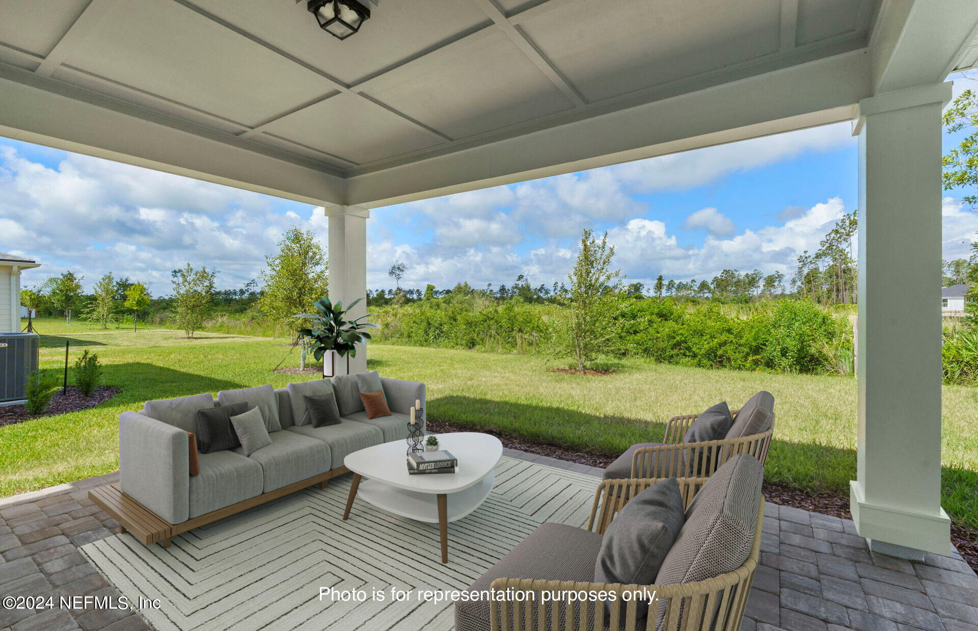 54 Torres Trace St. Augustine, FL 32095 - Photo 29 of 31 a outdoor living space with furniture and garden view