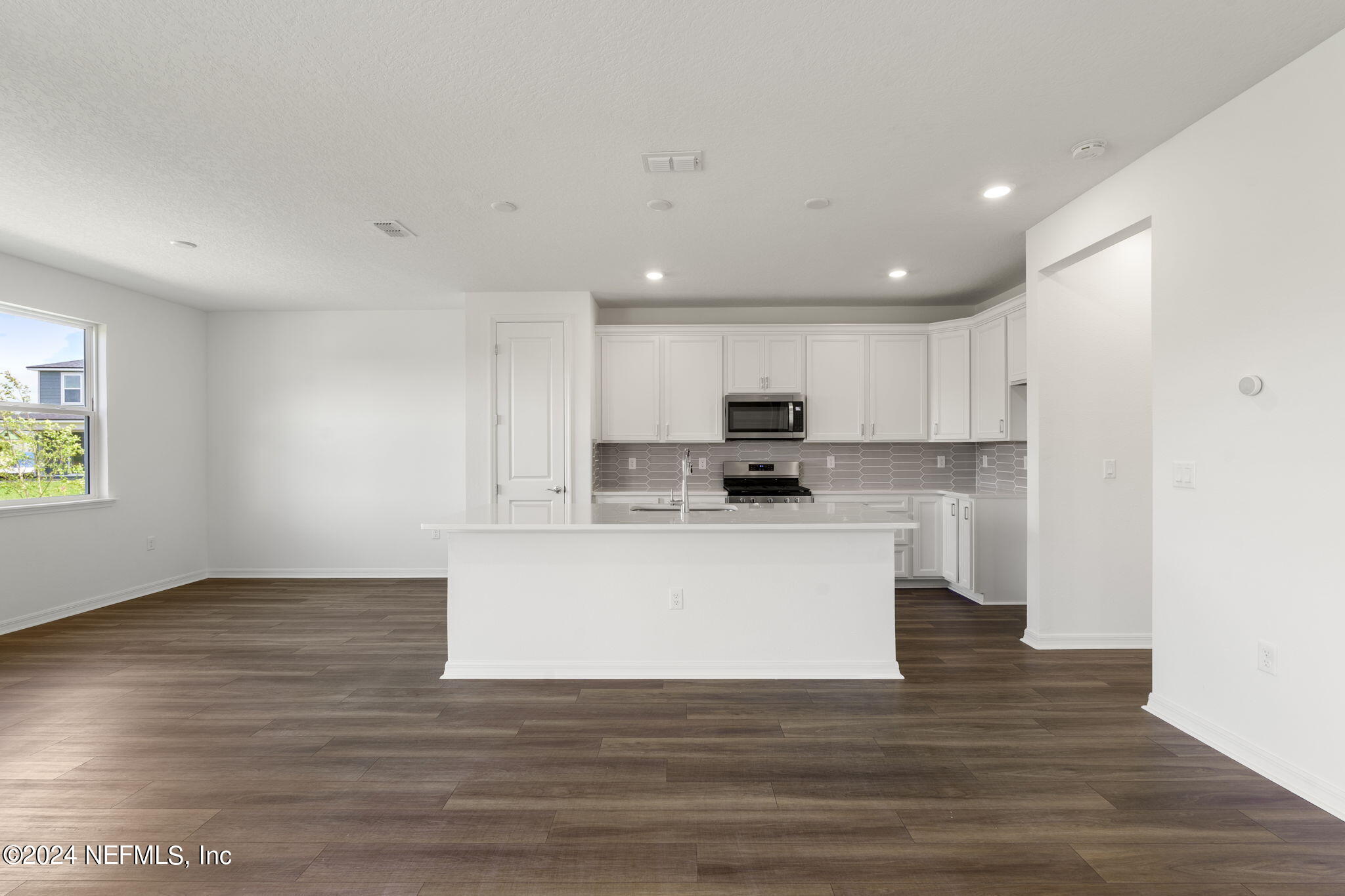 54 Torres Trace St. Augustine, FL 32095 - Photo 10 of 31 a view of kitchen with wooden floor and window