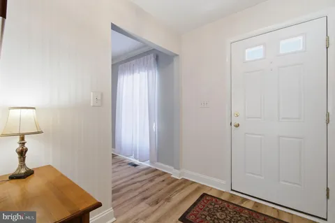 a view of a room that has a bed in it