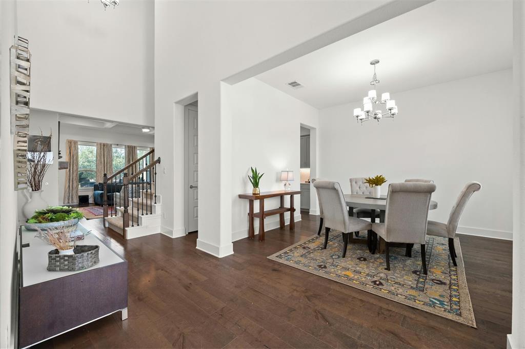 208 Slate Rock Terrace Austin, TX 78738 - Photo 11 of 29 a view of a dining room with furniture and chandelier