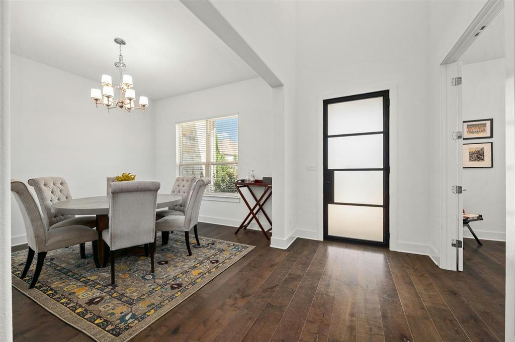 208 Slate Rock Terrace Austin, TX 78738 - Photo 12 of 29 a living room with furniture a piano and a window