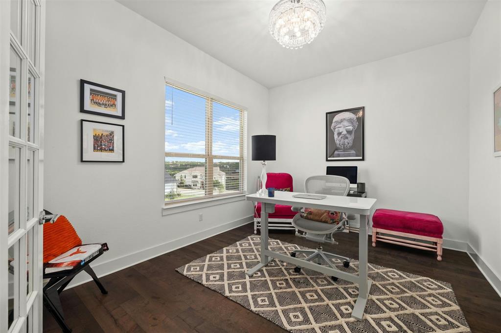 208 Slate Rock Terrace Austin, TX 78738 - Photo 13 of 29 a bedroom with a workspace